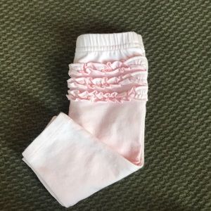 Never worn. Pink bottoms w/ruffle butt. Size: NB